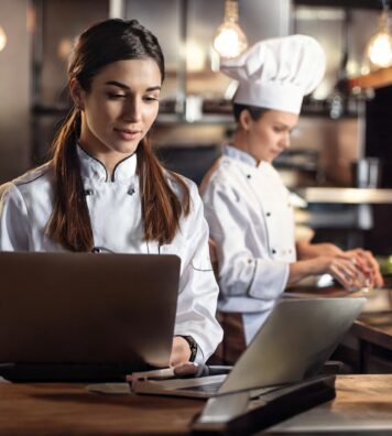 Firefly Teen brunette woman chef in resturant kitchen with business men Laptop 98430 Firefly Teen brunette woman chef in resturant kitchen with business men Laptop 98430