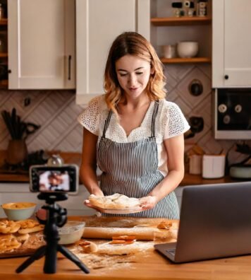 Firefly Woman in kitchen making pies, with sign Liv's Pies. Laptop and camera 53302 Firefly Woman in kitchen making pies, with sign Liv's Pies. Laptop and camera 53302