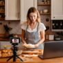 Firefly Woman in kitchen making pies, with sign Liv's Pies. Laptop and camera 53302 Firefly Woman in kitchen making pies, with sign Liv's Pies. Laptop and camera 53302