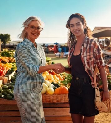 Firefly farmers market with a mexican woman and a wihte woman happy people. walking a smiling and sh Firefly farmers market with a mexican woman and a wihte woman happy people. walking a smiling and sh