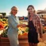 Firefly farmers market with a mexican woman and a wihte woman happy people. walking a smiling and sh Firefly farmers market with a mexican woman and a wihte woman happy people. walking a smiling and sh